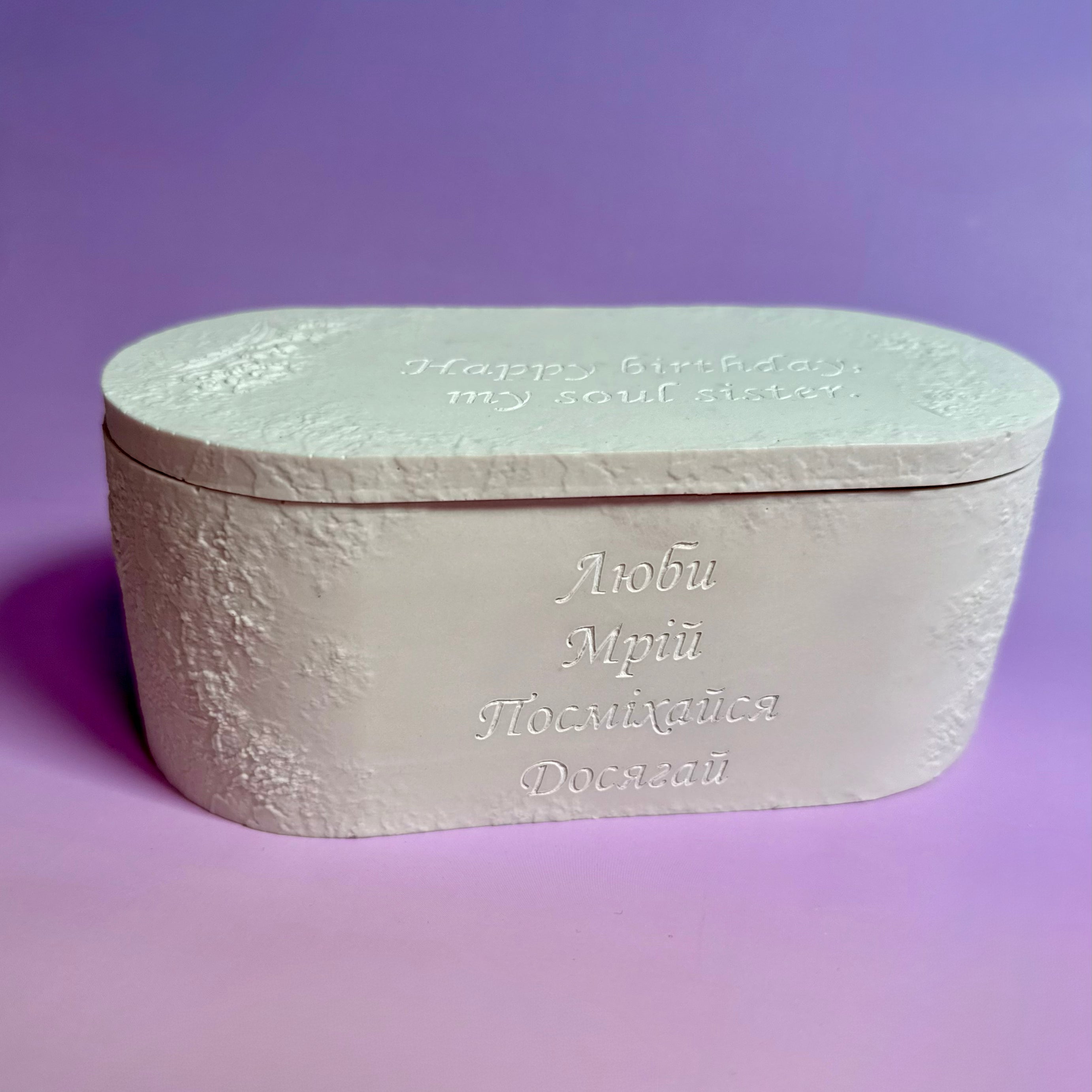 Luxury white Jesmonite candle pot with custom engraving, designed to be reused as a permanent keepsake jewellery box.