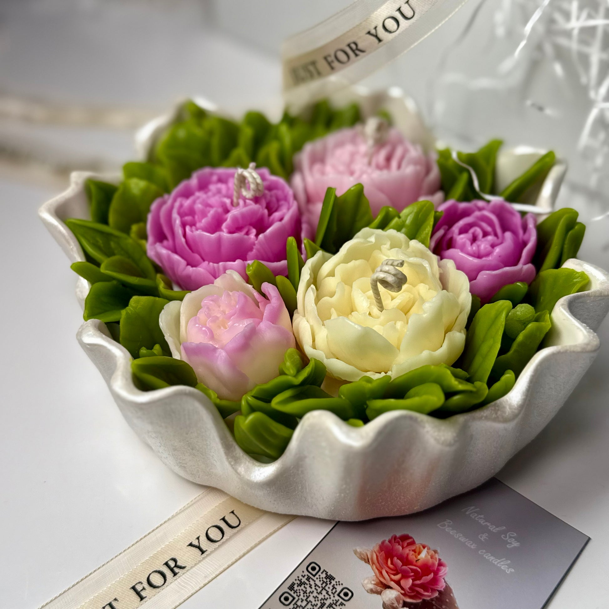 A side view of the grand 20cm multi-wick peony floral candle in its pearl white stone composite bowl styled next to a premium My Candle by Kris business card.