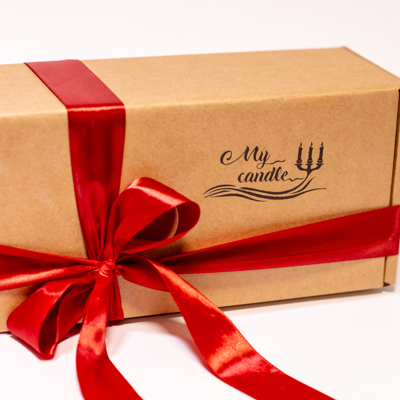 Personalised candle gift in a luxury box with a vibrant red ribbon, an ideal handmade gift UK for any special occasion.