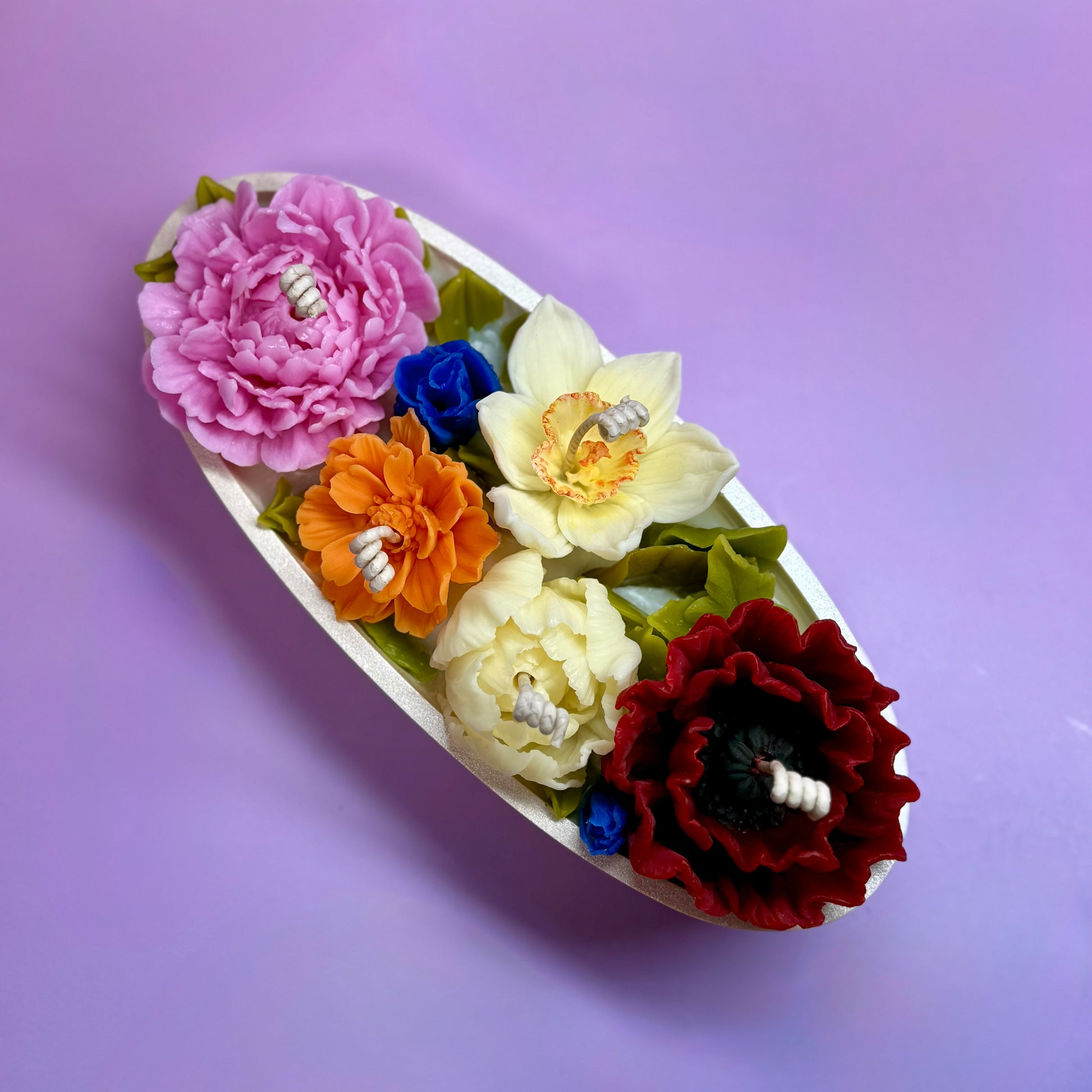 Close-up of floral candles showcasing intricate beeswax petal details, perfect for a high-end flower candle gift.
