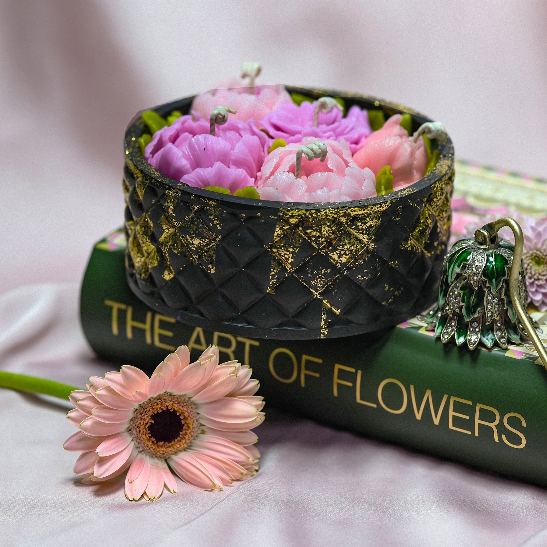 Black centrepiece floral candle with hand-painted gold details and decorative lid