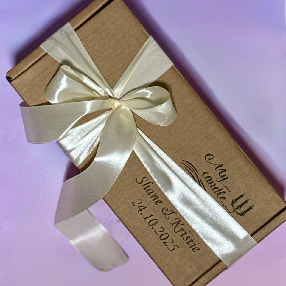 Bespoke gift packaging for a flower candle featuring a luxury satin ribbon with personaliыed laser engraving, perfect for a custom centrepiece floral candle gift.