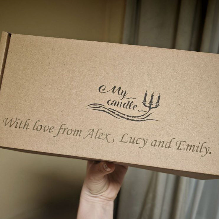 Eco-friendly cardboard candle gift box with a personalised engraved message.