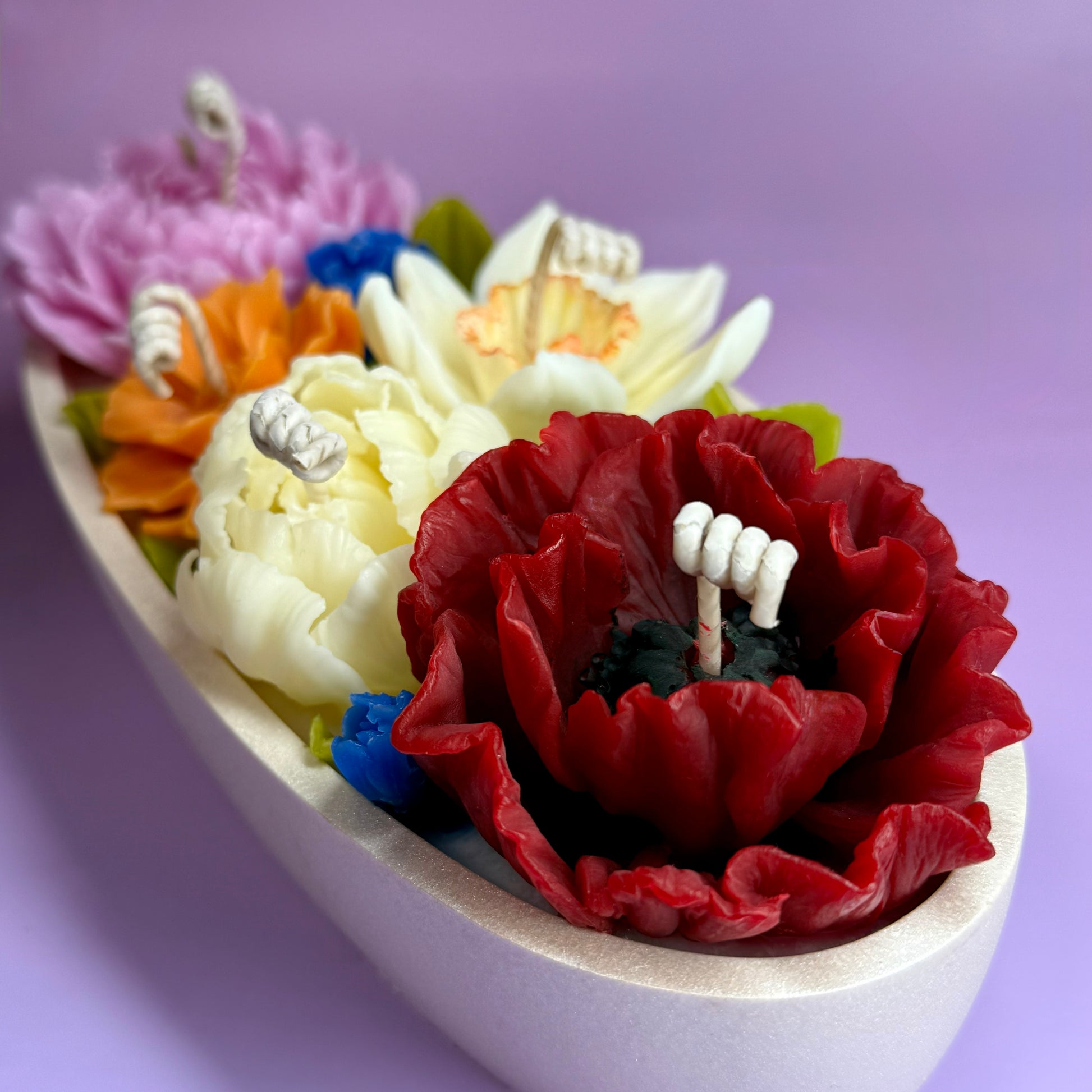 Close-up of floral candles showcasing intricate beeswax petal details, perfect for a high-end flower candle gift.