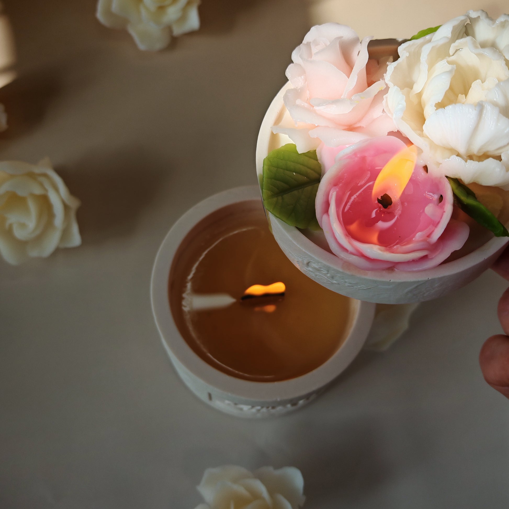 Top view showing both the soy wax base with a wooden wick and the floral beeswax lid burning simultaneously, creating a luxury home ambiance.