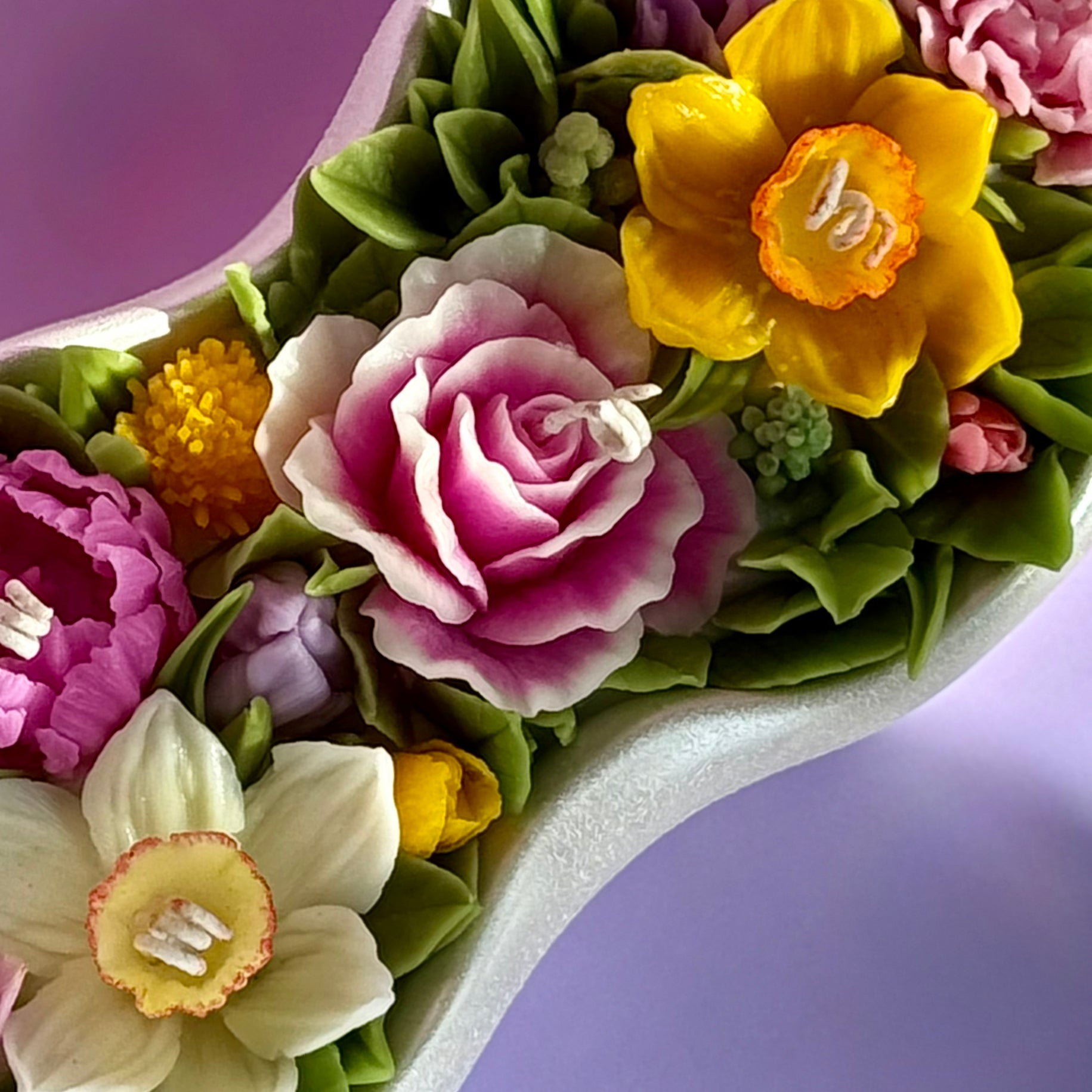 Bird's eye view of the 30cm floral arrangement featuring peonies, roses, and spring daffodils.
