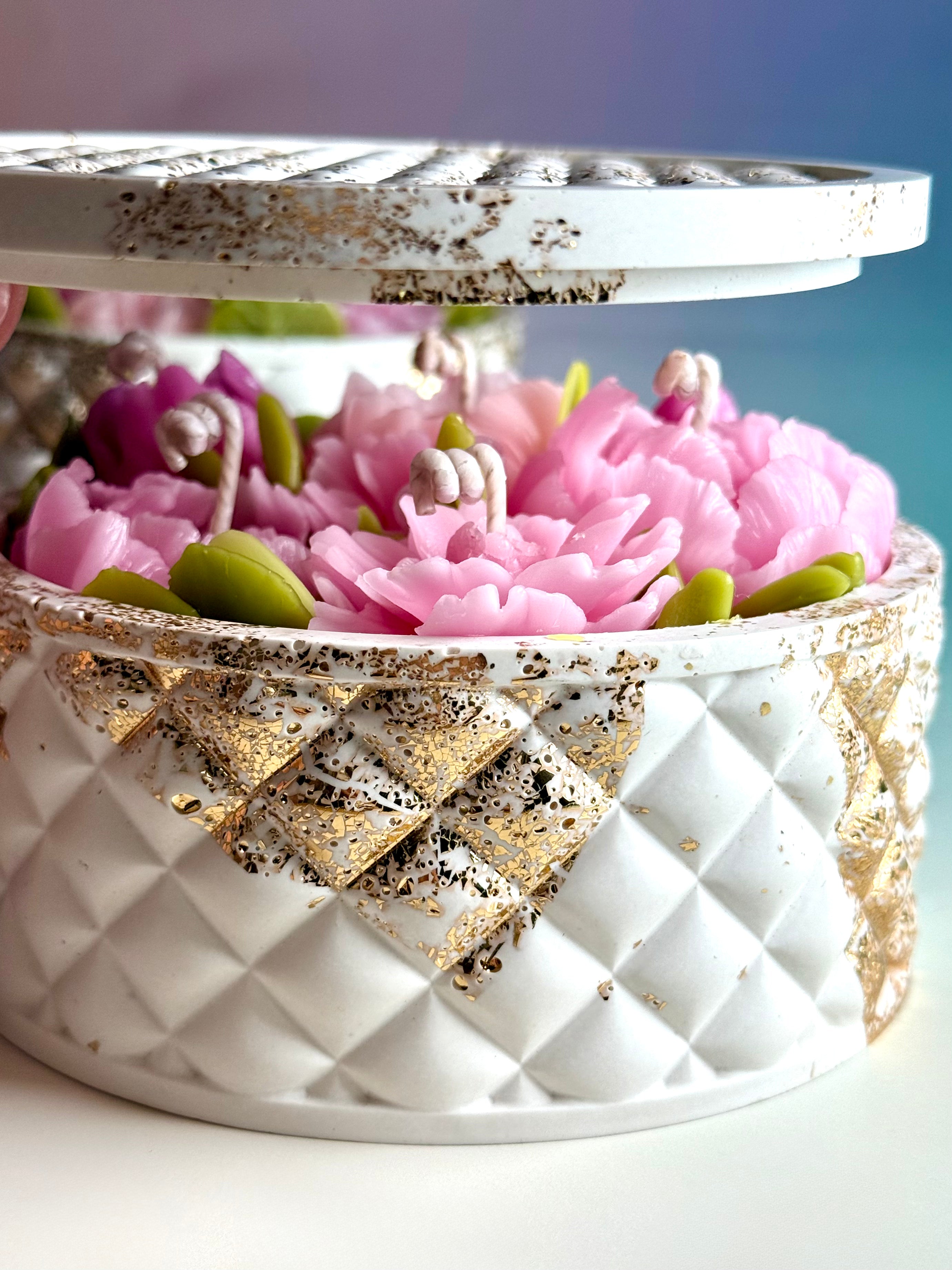 Handcrafted soy wax floral candle in an artisan stone-textured vessel