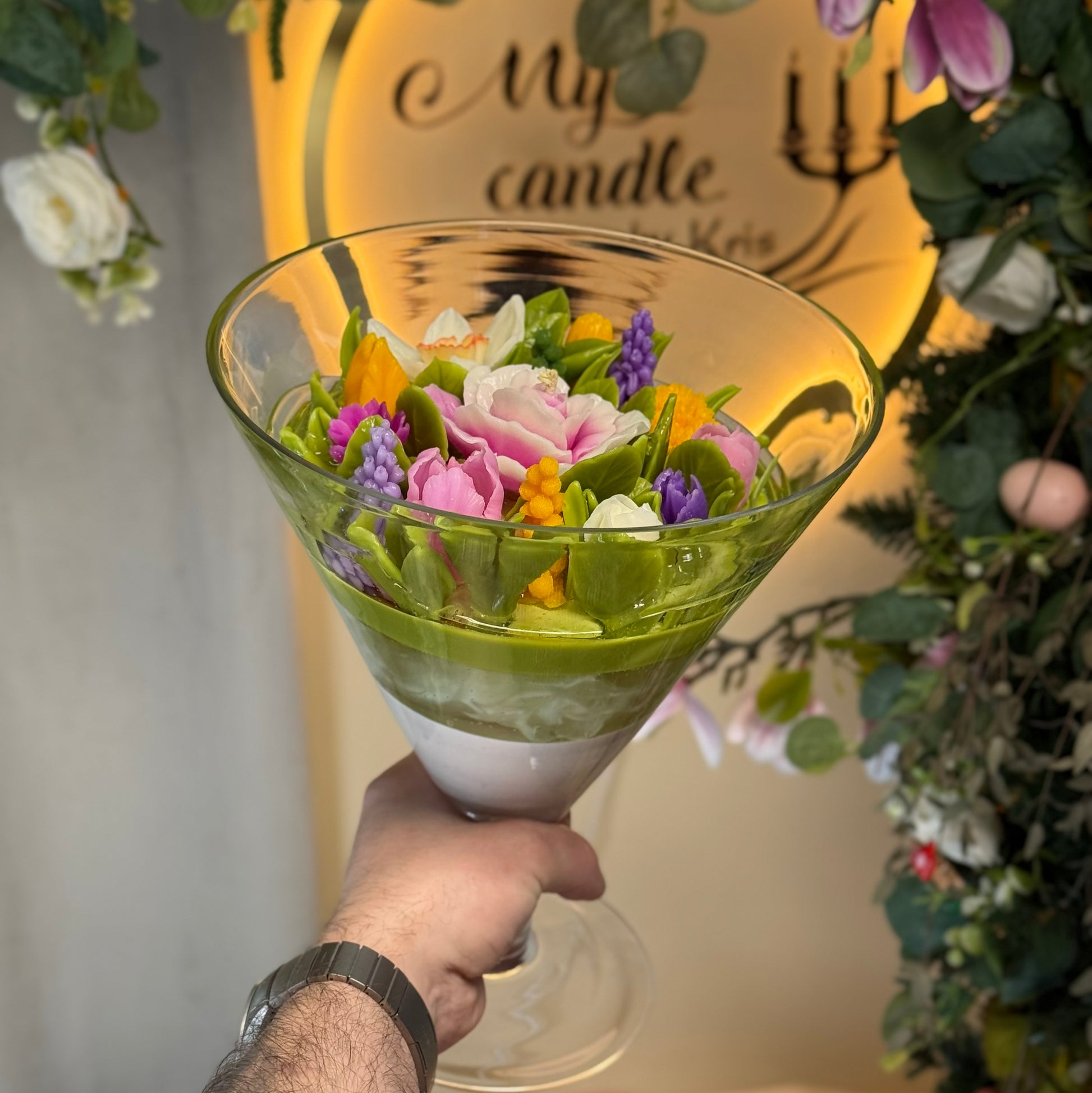 Side view of a premium round artisan flower candle bowl, showcasing handcrafted pink rose, vibrant yellow tulip, and detailed wax narcissus buds with gift box.