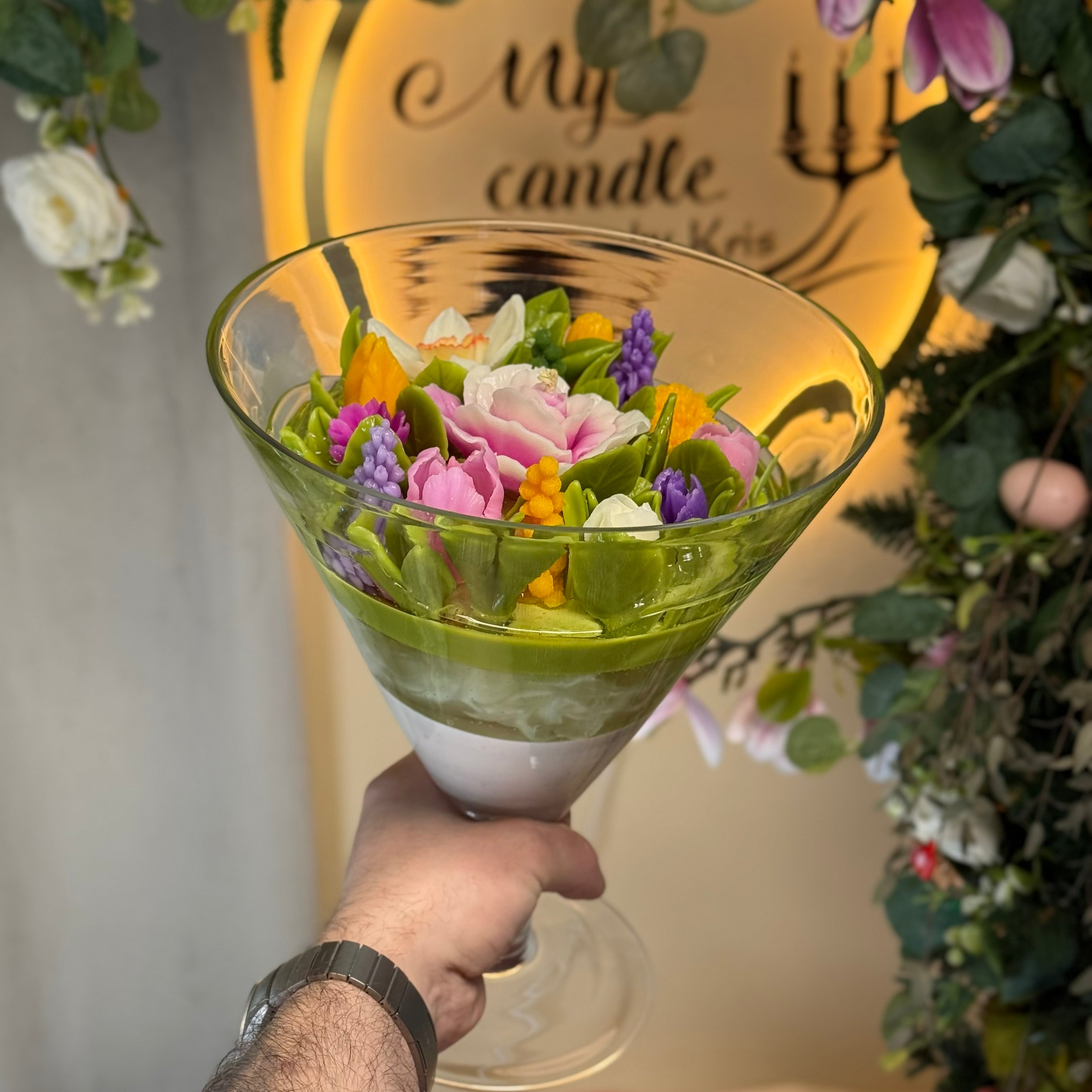 Side view of a premium round artisan flower candle bowl, showcasing handcrafted pink rose, vibrant yellow tulip, and detailed wax narcissus buds with gift box.