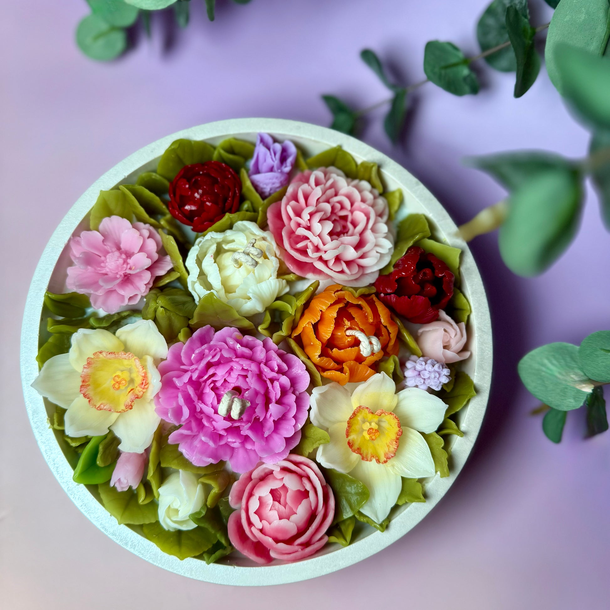 Vibrant floral candles with a variety of sculpted beeswax petals, making it an ideal centrepiece candle for dining tables.