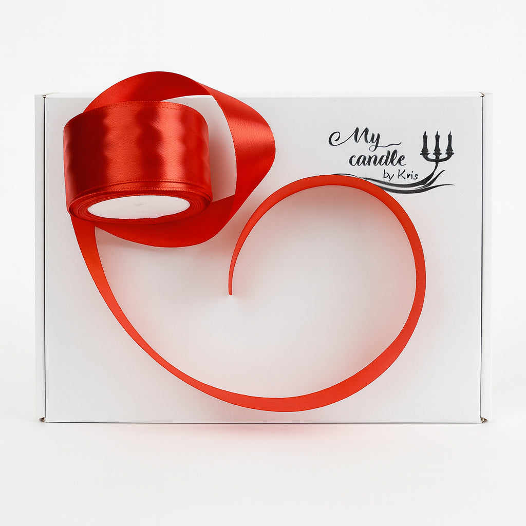 Luxury white gift box with the "My Candle by Kris" logo, featuring a vibrant red satin ribbon roll, showcasing premium candle gift packaging for a bespoke unboxing experience.