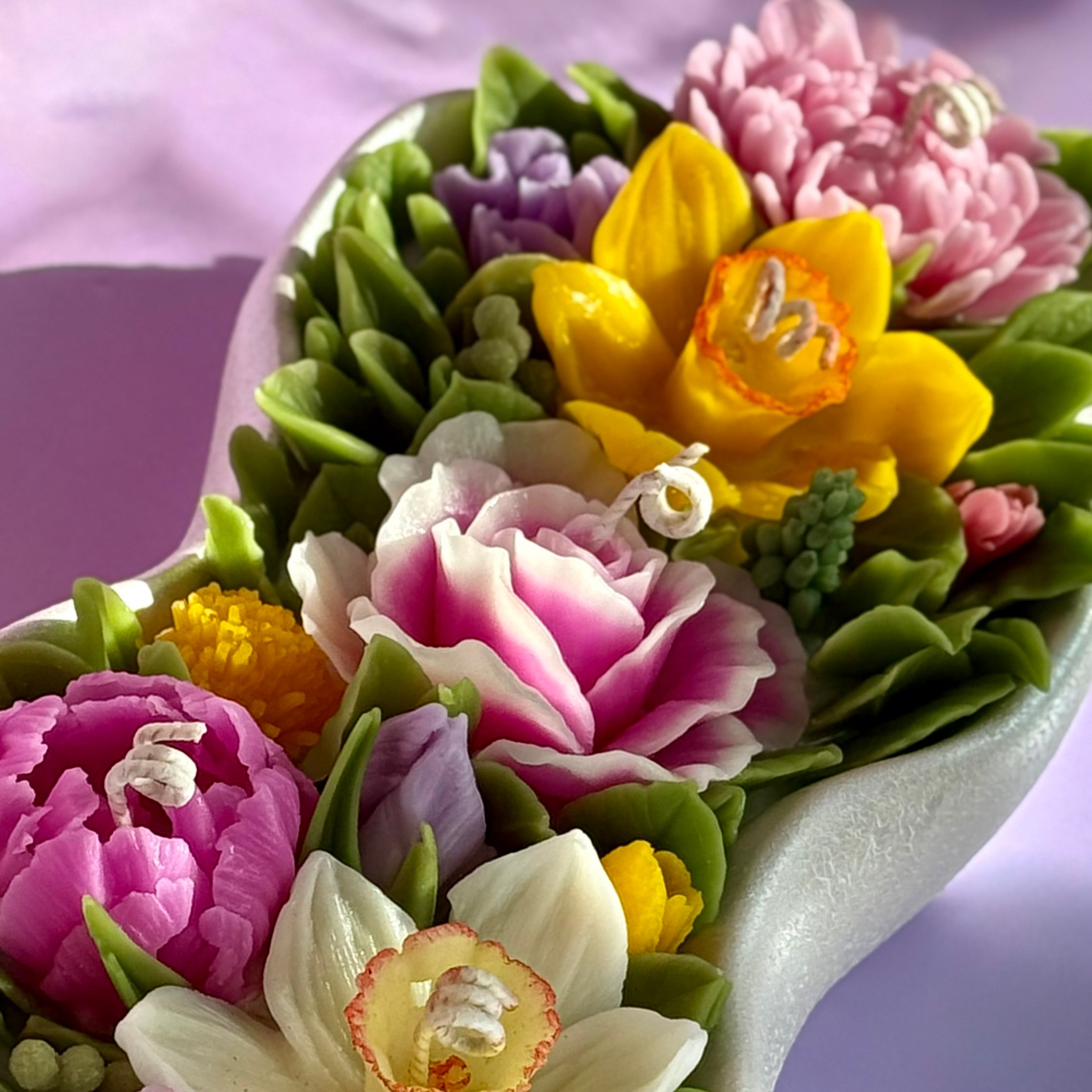 Bird's eye view of the 30cm floral arrangement featuring peonies, roses, and spring daffodils.