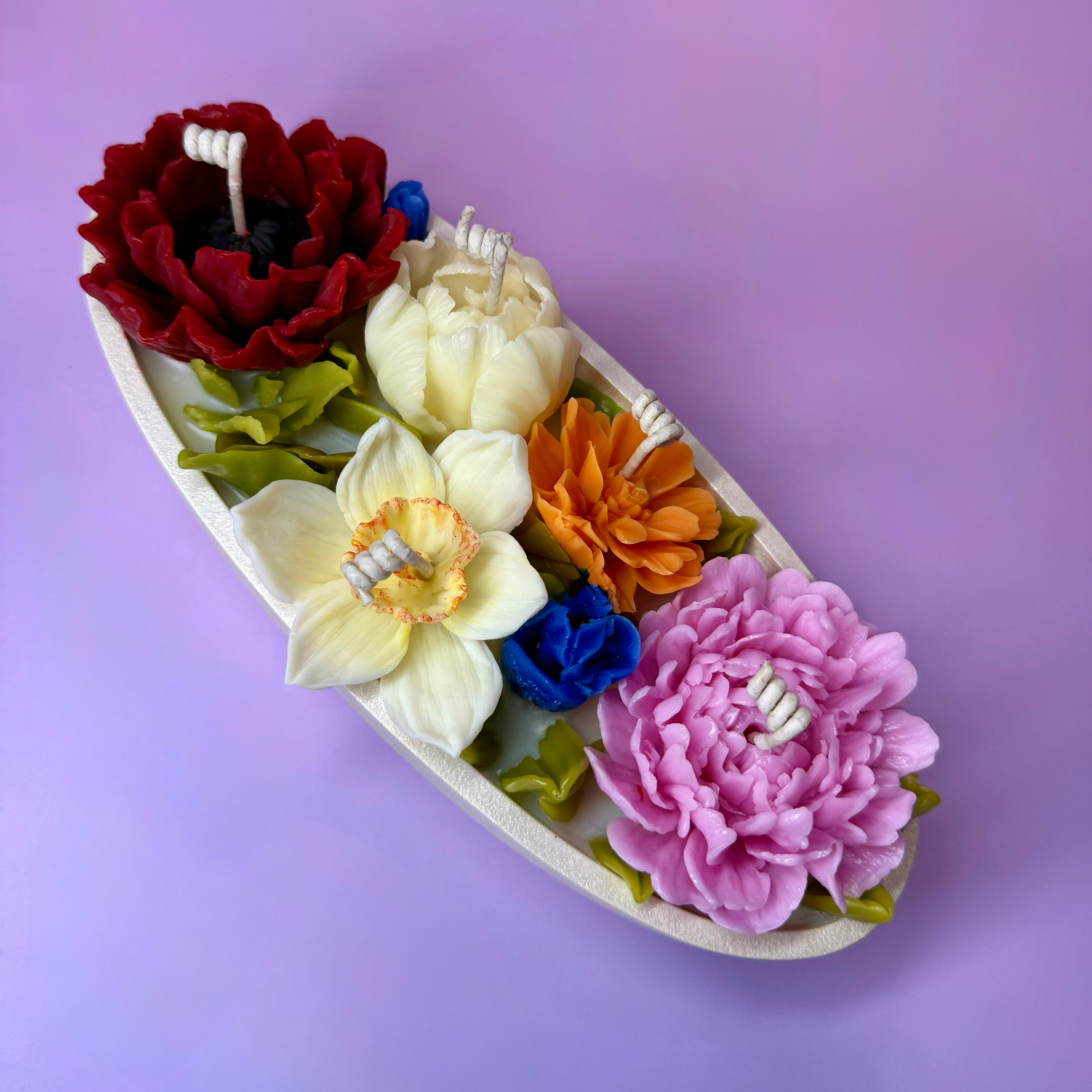 Top view of a floral candle set with handcrafted beeswax flowers, designed as a unique botanical centrepiece candle.