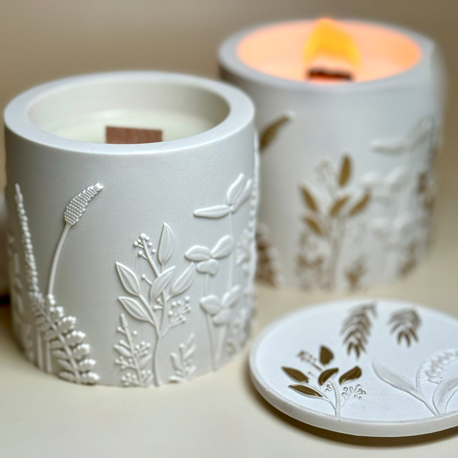 High angle shot of an open pearlescent white wildflower soy candle container showing the clean-burning natural wax surface.