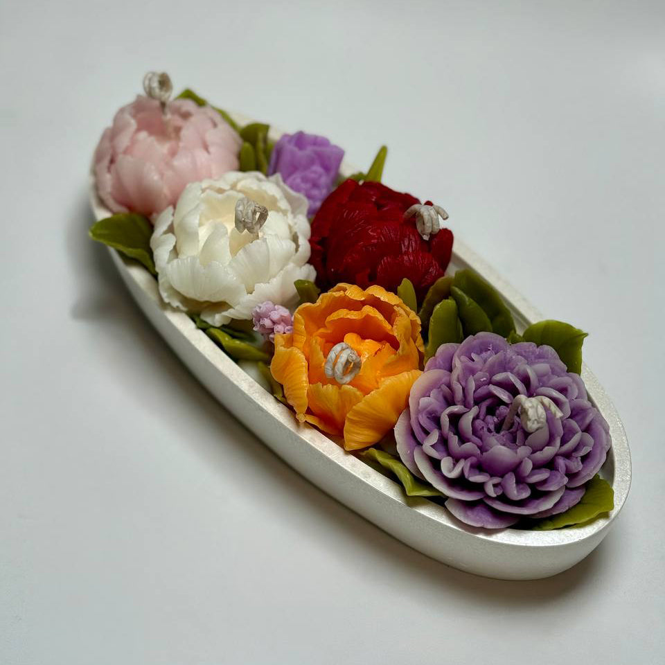 Vibrant beeswax peony and tulip flowers on a soy wax base in a pearl white bowl.